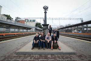 a group of people on a train track